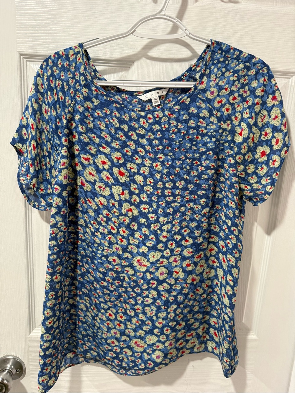 CAbi Blue Floral Short Sleeve Top with Red and Cream Accents, cute detail back